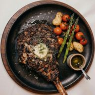 Charred Tomahawk with Garlic-Herb Compound Butter photo 1