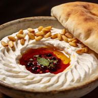 Sizzling Maras Butter Labneh with Toasted Pine Nuts photo 1