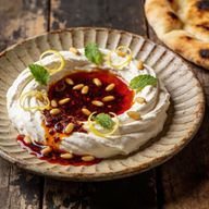 Sizzling Maras Butter Labneh with Toasted Pine Nuts photo 1