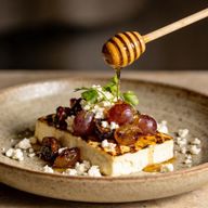 Hearth-Roasted Feta with Honeyed Grapes photo 1