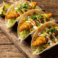 Zesty Buffalo Fried Fish Tacos with Lime Crema photo 1