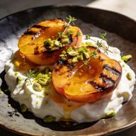 Hearth-Charred Peaches with Honeyed Yogurt & Pistachio photo 1