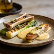 Wood-Fired Leeks with Smoked Marrow Hollandaise photo 1