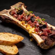 Wagyu Tartare & Roasted Marrow with Black Garlic Emulsion photo 1